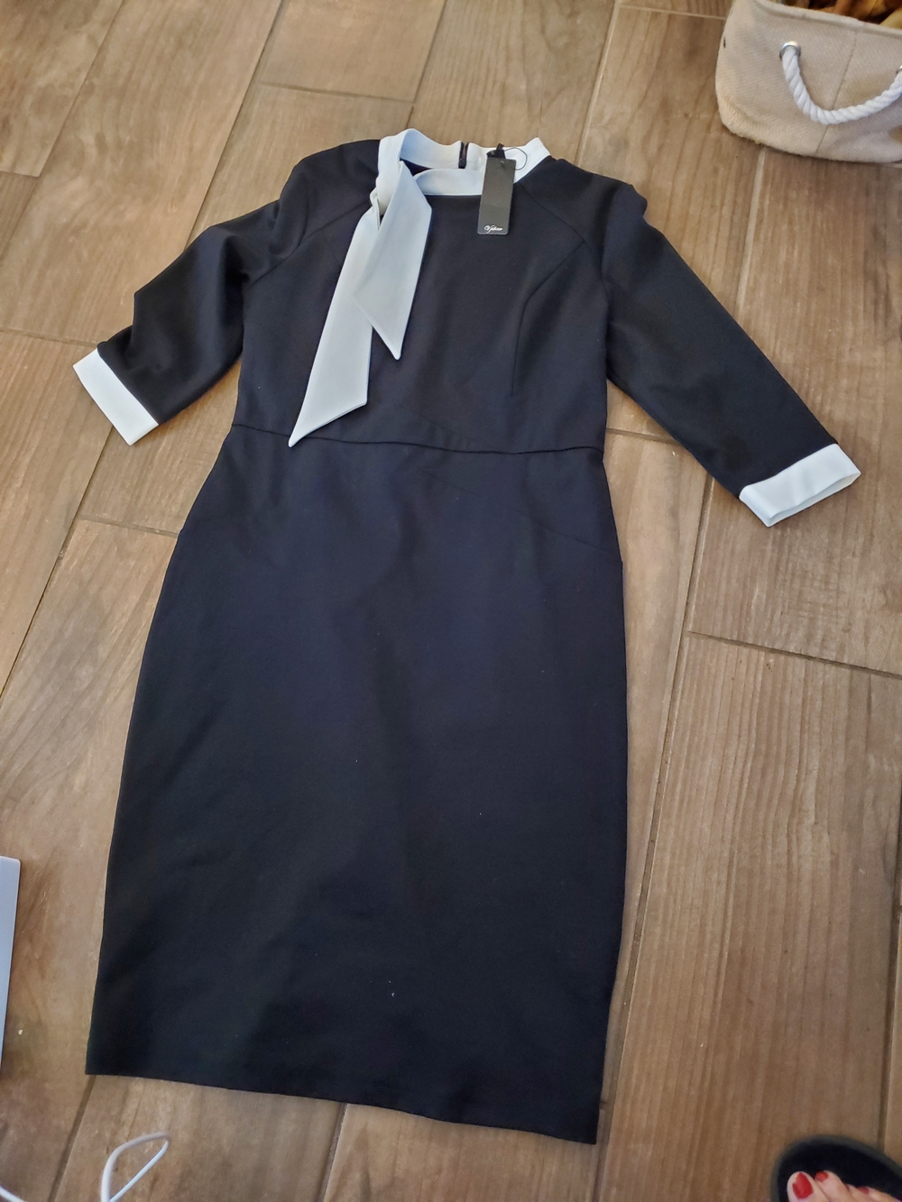 Black Midi Dress with White Tie-Neck and Cuff Accents